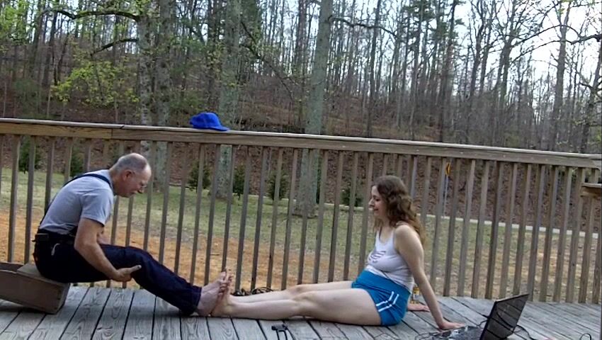 Girl compares her feet with older man