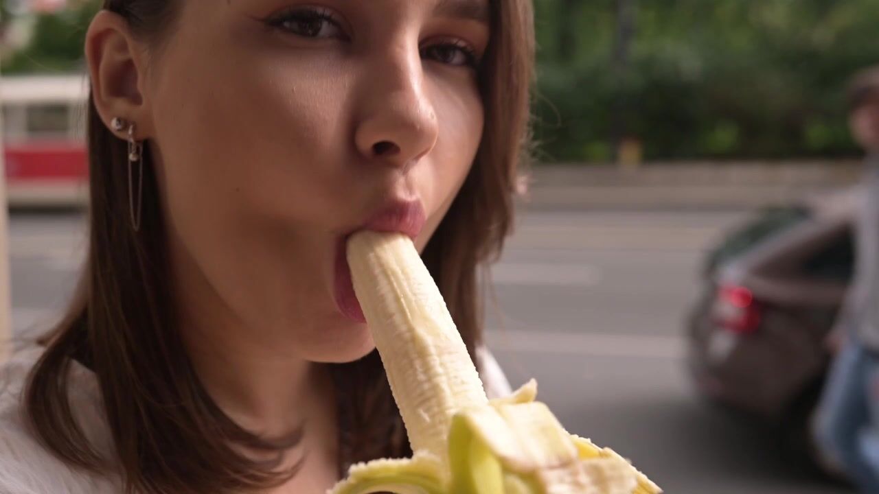 ELLIE in the streets flashing and sucking a banana and in a restaurant